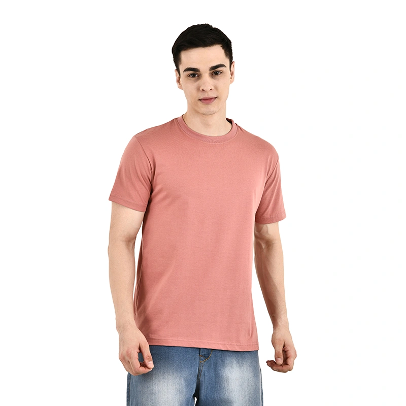 Male model in solid dusty rose round-neck t-shirt with blue denim jeans - menswear ecommerce photography by Lohar Studio Delhi